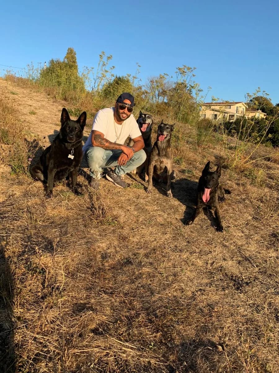 Jas Leverette with four of his own dogs